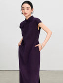 Close view of the tailored waist and side pockets on a purple gambiered silk qipao dress.