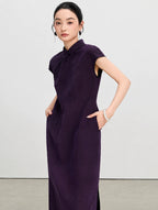 Close view of the tailored waist and side pockets on a purple gambiered silk qipao dress.