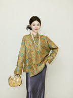 Full look featuring a model wearing a loose patterned reversible mulberry silk jacket with a dark skirt