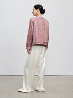 Back view of the dusty mauve side of the reversible 100% mulberry silk Shu brocade jacket.