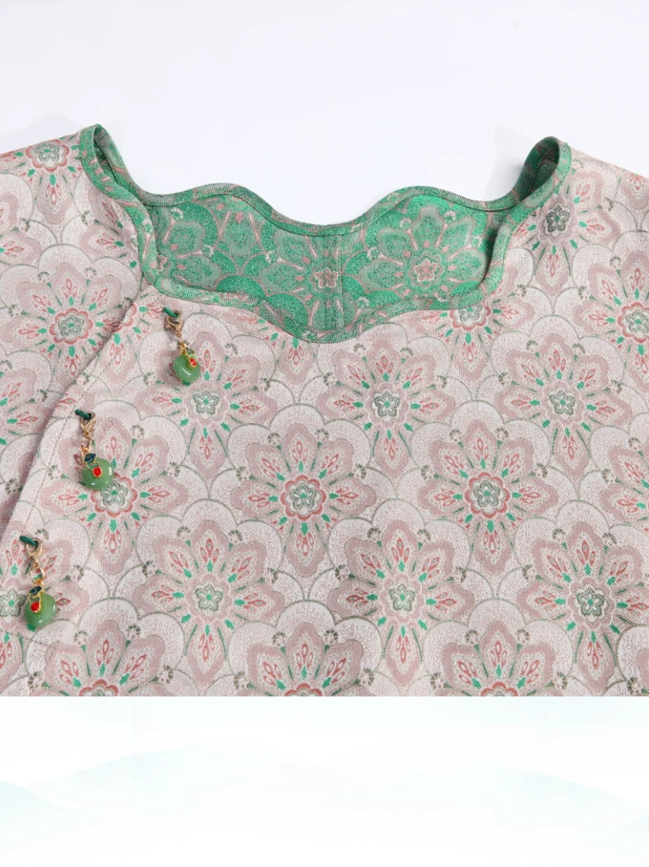 Neckline detail of the reversible pink and jade-green Song brocade silk dress.