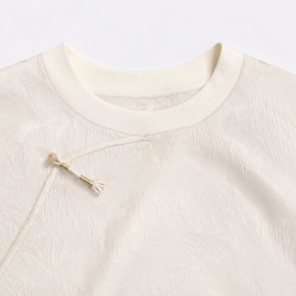 Close-up of the round neckline and diagonal Chinese-style closure