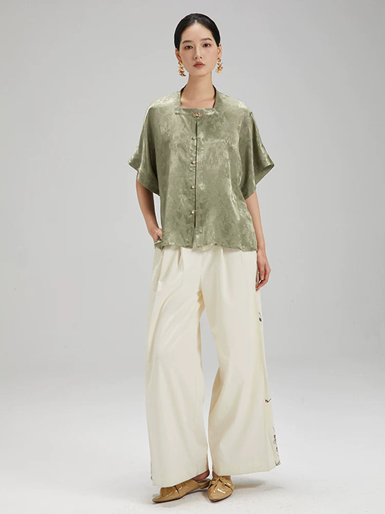 Full outfit featuring the Sage Green Jacquard Mandarin Collar Blouse paired with wide-leg trousers.