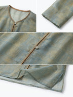 Close-up details of a sage green mulberry silk jacket with patterned fabric, contrast piping and button closure