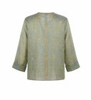 Back view of a sage green Chinese-inspired silk jacket with geometric woven pattern