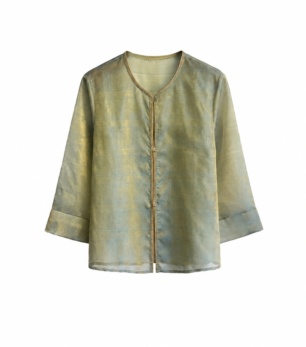 Front view of a sage green patterned mulberry silk jacket with long straight sleeves