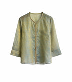 Front view of a sage green patterned mulberry silk jacket with long straight sleeves