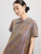 Model portrait wearing the vintage gauze-weave silk dress with a softly lustrous multicolor finish.