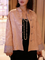 Close-up of the mandarin collar and Chinese frog closures on a blush pink silk jacket
