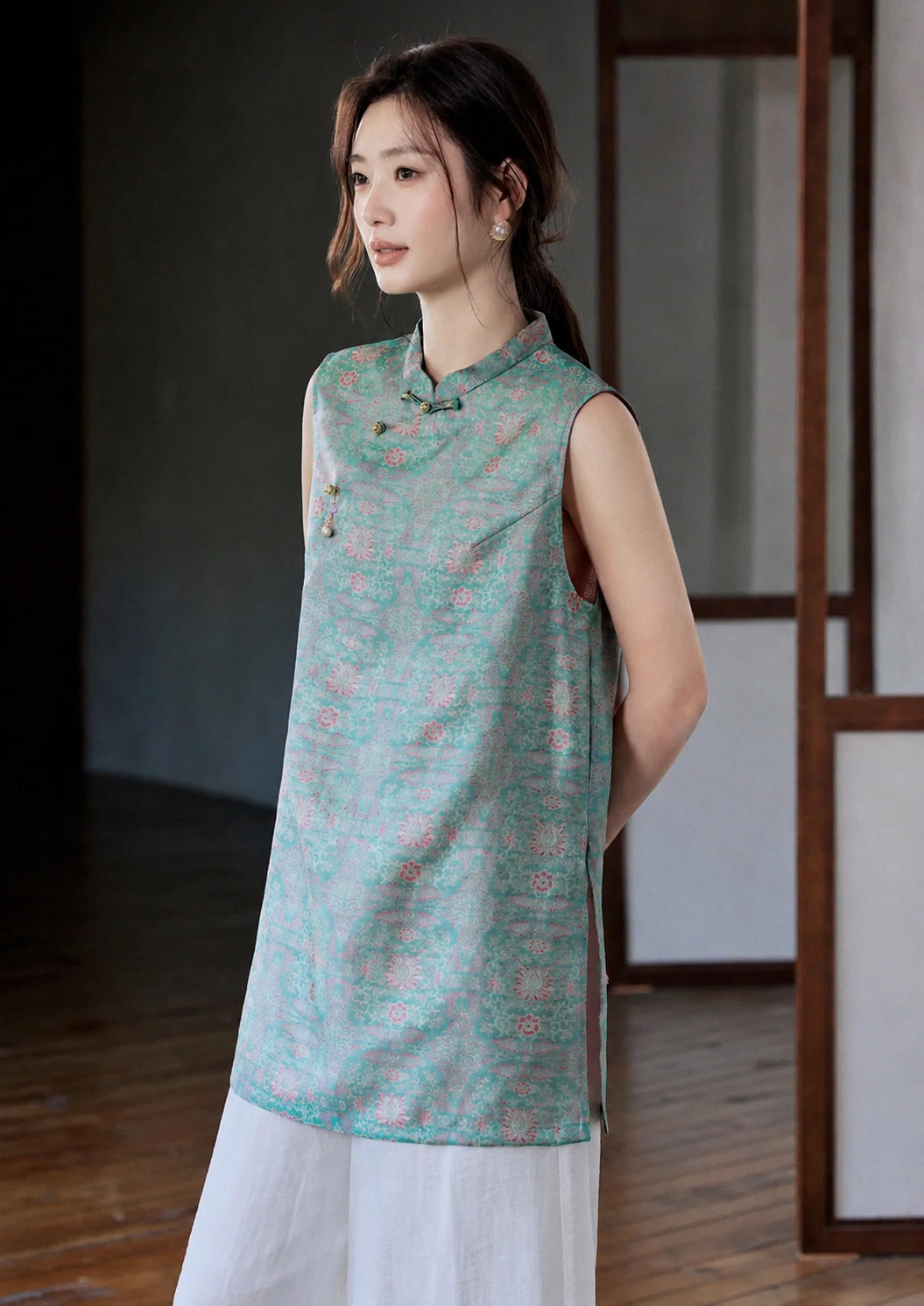 Upper-body view of the stand collar, ornamental buttons and teal-pink Song brocade pattern