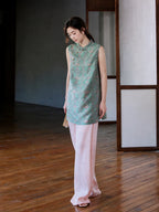 Front view of the teal Song brocade vest with a stand collar and asymmetrical knot buttons