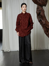Full-length styling of the burgundy textured Mandarin Collar Cotton Blend Blouse paired with wide-leg black trousers.