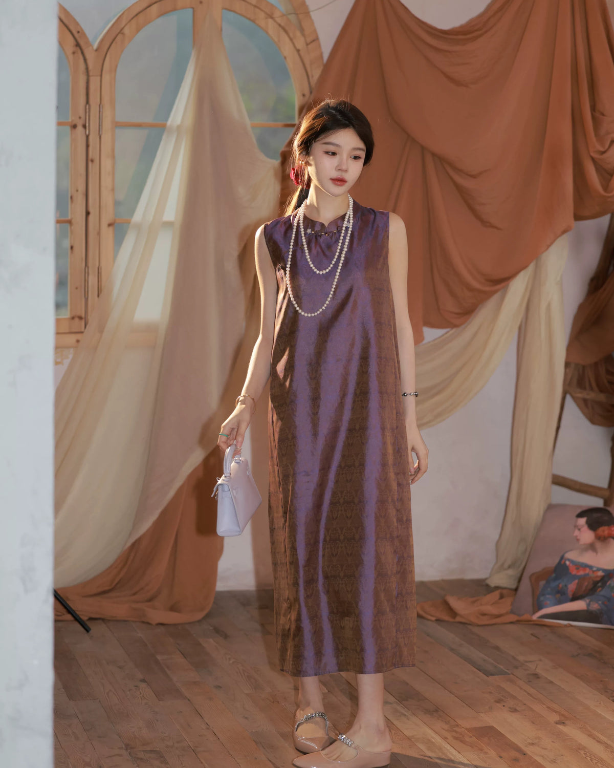 Model wearing a vintage plum 100% mulberry silk sleeveless mandarin collar dress