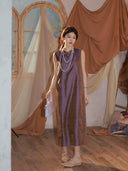 Model wearing a vintage plum 100% mulberry silk sleeveless mandarin collar dress