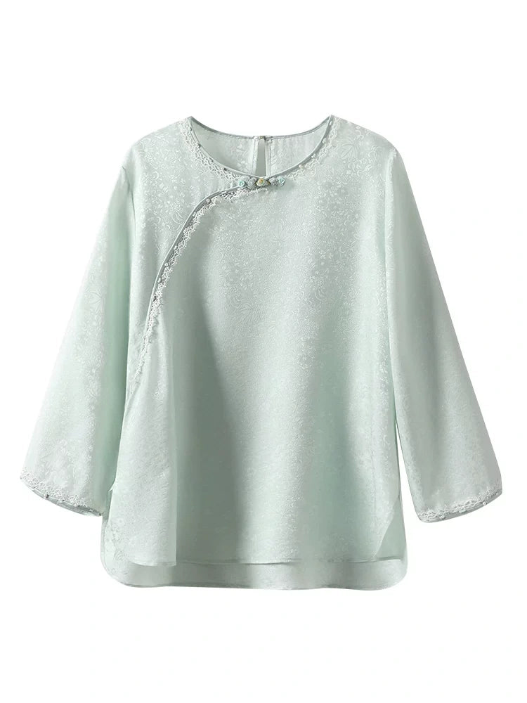 Gambiered Silk water blue silk-blend jacquard blouse with a round neck, three-quarter sleeves and decorative buttons