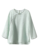 Gambiered Silk water blue silk-blend jacquard blouse with a round neck, three-quarter sleeves and decorative buttons