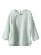 Gambiered Silk water blue silk-blend jacquard blouse with a round neck, three-quarter sleeves and decorative buttons