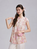 Gambiered Silk watercolor floral top featuring a Mandarin collar, short sleeves and embroidered flower detail