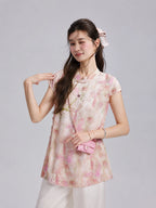Gambiered Silk watercolor floral top featuring a Mandarin collar, short sleeves and embroidered flower detail