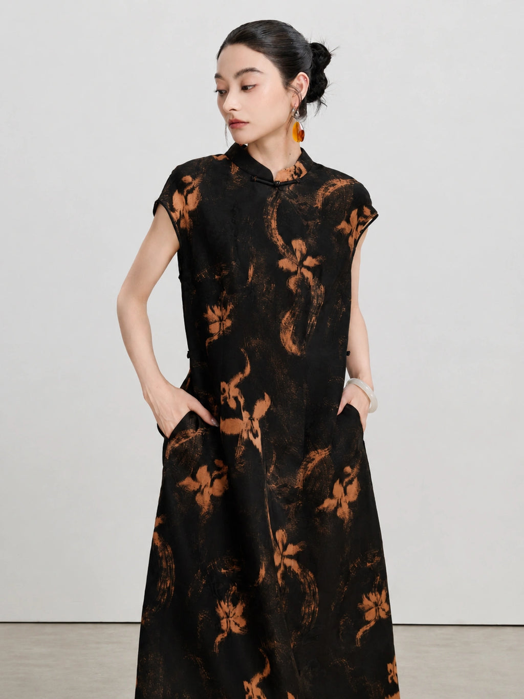 Model displaying the side pockets and flowing shape of the Xiangyunsha Hua Luo dress