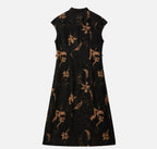 Back view of a black Xiangyunsha Hua Luo silk A-line dress with copper-brown floral motifs