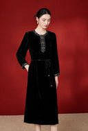 Angled model view showing the embroidered placket and softly flared skirt