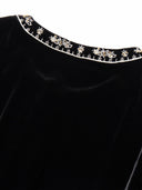 Close-up of the gold-toned embroidery around the round neckline