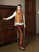 Full-length styling view of the Gilded Ochre vest with a brown skirt