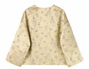 Back view of the apricot-gold jacket showing its small floral, butterfly and animal motifs.