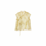 Flat lay of a gold short-sleeve Cheongsam top with a mandarin collar, floral embroidery, and side tie details.