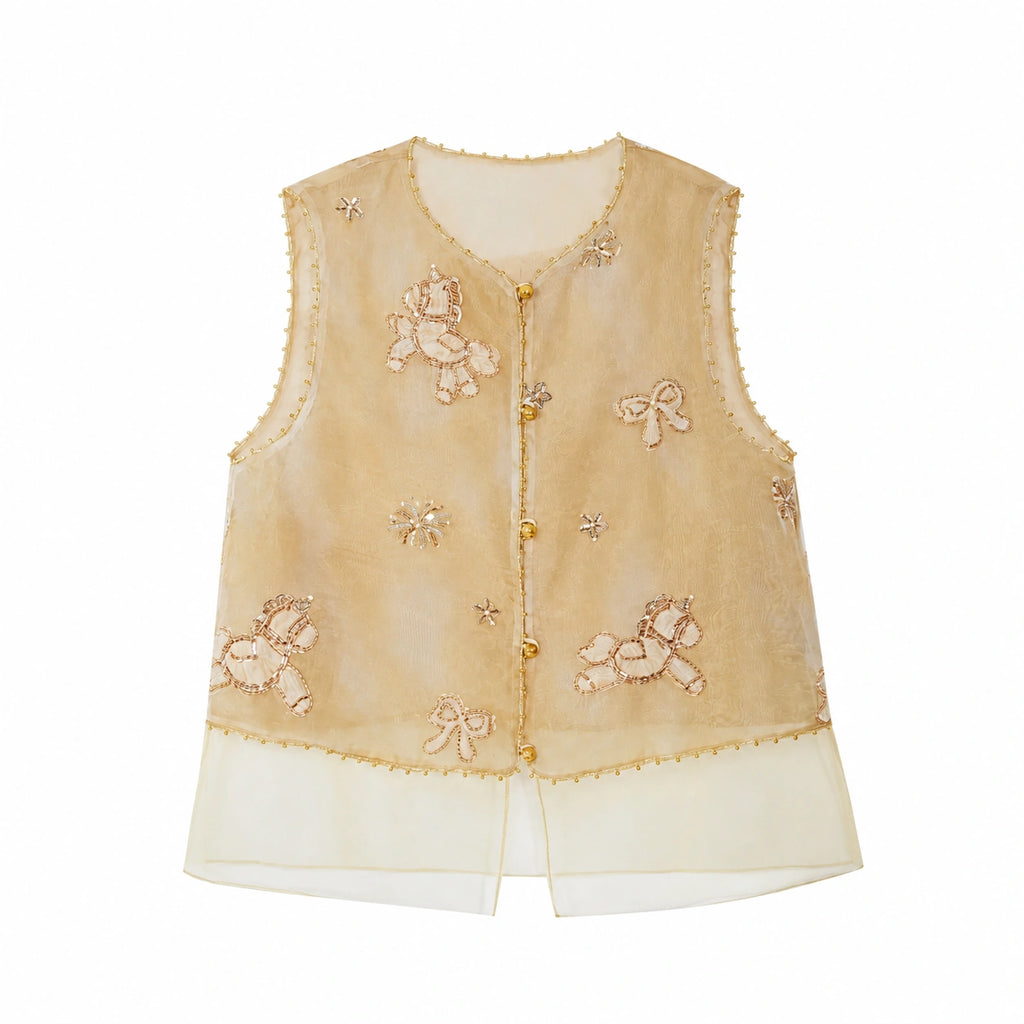 Flat lay of a gold sleeveless vest with beaded edges, floral and bow embroidery, gold buttons, and a layered sheer hem, crafted from 100% polyester.