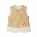 Flat lay of a gold sleeveless vest with beaded edges, floral and bow embroidery, gold buttons, and a layered sheer hem, crafted from 100% polyester.