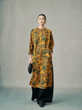 Model wearing a gold floral 100% mulberry silk cheongsam dress