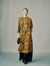 Model wearing a gold floral 100% mulberry silk cheongsam dress