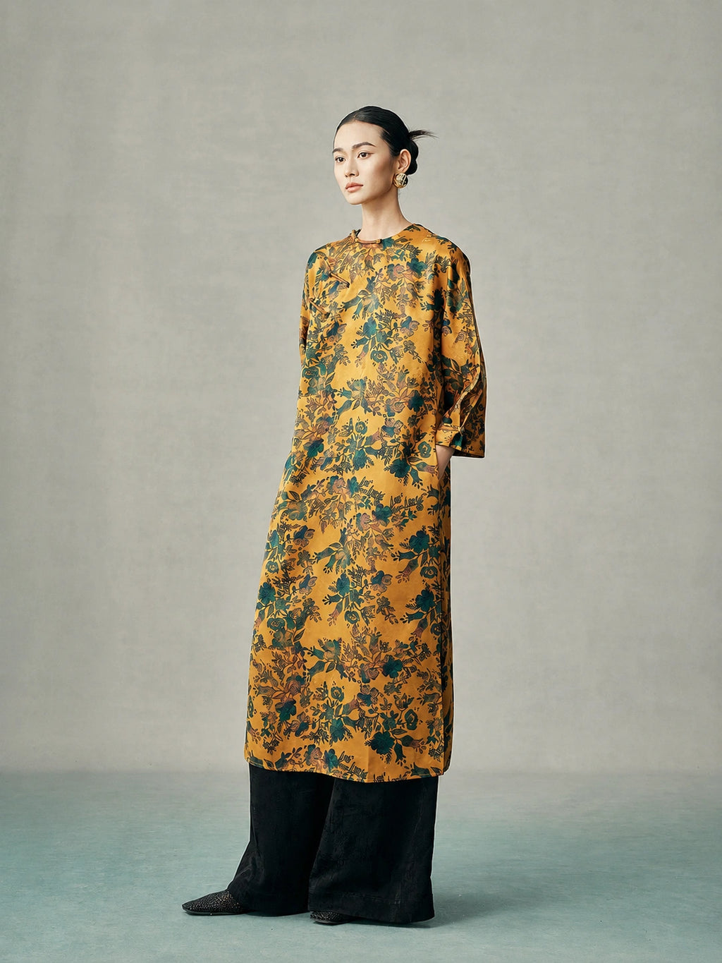 Side view of a gold floral mulberry silk cheongsam dress