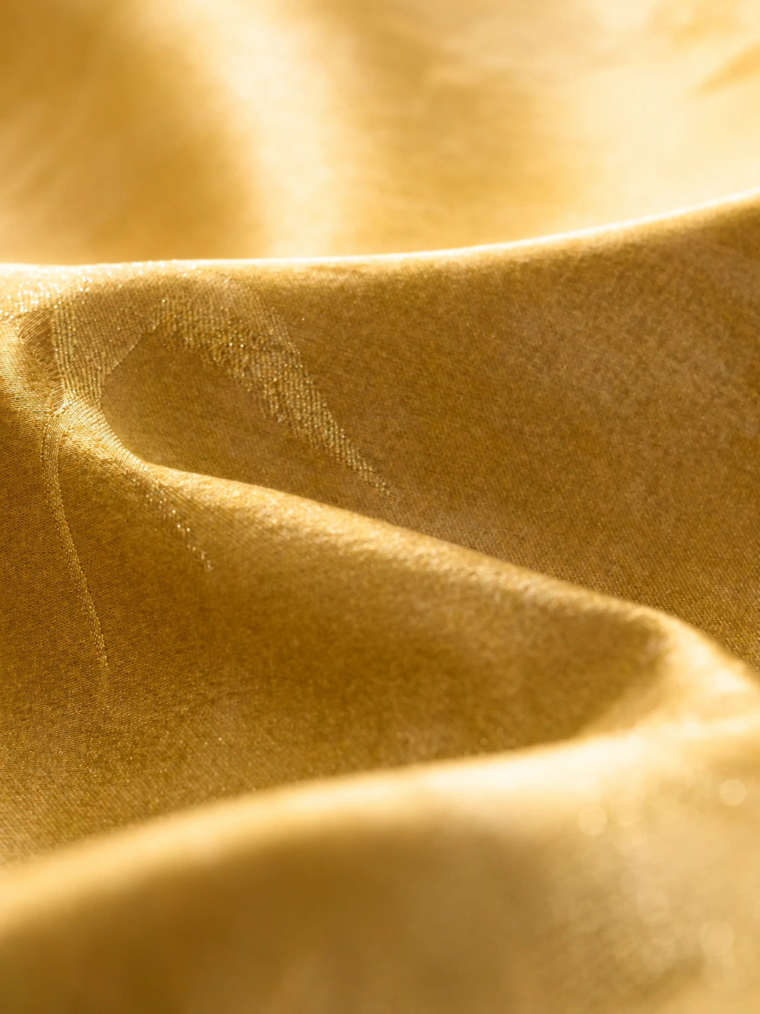 Close-up of the smooth silk blend fabric with a soft sheen, highlighting the natural texture and drape.