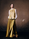 Women's floral embroidered silk blend vest paired with a flowing satin skirt for an elegant oriental-inspired outfit.