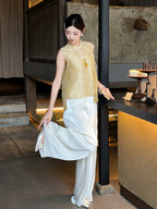 Side view of a gold Cheongsam top worn with white wide-leg palazzo pants, styled with a fan and pearl necklace.