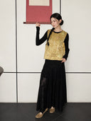 Model wearing a gold Zhangduan silk Chinese vest with a round neckline, floral jacquard texture, and colorful butterfly motifs.