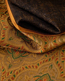 Close-up of the textured gold jacquard beside the dark-brown patterned fabric