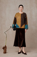 Full-length styling view of the jacket paired with a dark skirt