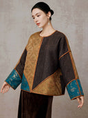 Angled front view showing the jacket’s asymmetric gold jacquard and dark-brown panels
