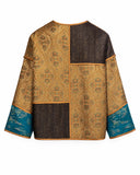 Product-only back view showing the jacket’s gold jacquard and dark-brown patchwork panels