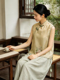 Golden yellow mulberry silk vest with hand-knotted frog closures styled with wide-leg pants