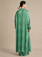 Back view of the silk tunic demonstrating the straight, fluid drape and high side slits that create a relaxed, elegant, and effortlessly chic silhouette.