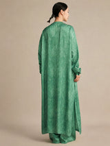 Back view of the silk tunic demonstrating the straight, fluid drape and high side slits that create a relaxed, elegant, and effortlessly chic silhouette.