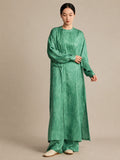 Model wearing a light green 100% mulberry silk crinkled tunic, showcasing the relaxed, comfortable silhouette and natural drape from the front.