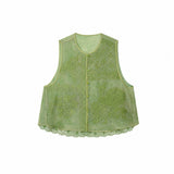 Flat lay of a green sleeveless Cheongsam vest with round neck, button front, intricate floral embroidery, and scalloped lace hem, crafted from 100% polyester.
