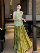 Model in a green embroidered Cheongsam vest with floral details, holding a fan and standing indoors, showcasing the 100% polyester fabric.