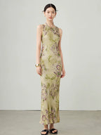 Side angle of women's floral sleeveless maxi dress in cupro blend fabric.